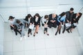 Top view. Manager discussing business schedules with company employees