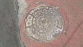 Top view of a manhole cover on drainage or sewerage under paved road Royalty Free Stock Photo