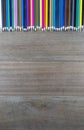 Top view many color pencils on wood background with copy space for text or design Royalty Free Stock Photo
