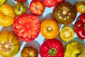 Top view of many delicious fresh tomatoes of different sort. Summer taste. Garden, domestic products. Full and sliced Royalty Free Stock Photo