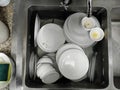 Top view many dirty dishes in the kitchen sink Royalty Free Stock Photo