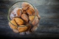 top view of handmade baked nuts with boiled condensed milk in glass jar