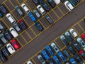 Top view of many parked cars waiting for shipping aerial drone view lined up structured Royalty Free Stock Photo