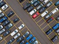 Top view of many parked cars waiting for shipping aerial drone view lined up structured Royalty Free Stock Photo