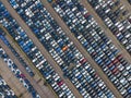 Top view of many parked cars waiting for shipping aerial drone view lined up structured Royalty Free Stock Photo