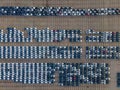 Top view of many parked cars waiting for shipping aerial drone view lined up structured Royalty Free Stock Photo