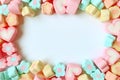 Top View of Many Pastel Color Flower Shaped and Heart Shaped Marshmallow Candies with Free Space for Text and Design