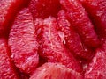 Top view of many pieces of peeled grapefruit