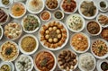 Top view of many plates on dinner dishes from different dishes covered in sauce on white background Royalty Free Stock Photo