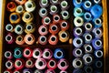 Top view of many reels of threads for embroidery or sewing, colorful background Royalty Free Stock Photo