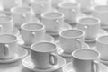 Top view on many stacked in rows of empty clean white cups for t Royalty Free Stock Photo