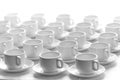 Top view on many stacked in rows of empty clean white cups for t Royalty Free Stock Photo