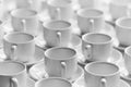 Top view on many stacked in rows of empty clean white cups for tea or coffee. Close-up. Background. Royalty Free Stock Photo