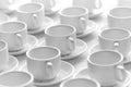 Top view on many stacked in rows of empty clean white cups for tea or coffee. Close-up. Background. Royalty Free Stock Photo