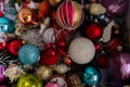 Top view of many various Christmas balls and toys in cardboard box, nobody, closeup. Concept of preparation home to new Royalty Free Stock Photo