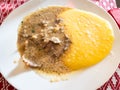 top view of Manzo all 'Olio with polenta on plate Royalty Free Stock Photo