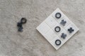 Top view marble Tic Tac Toe or OX board game on soft carpet with copy space. concept of strategy, risk, competition in business Royalty Free Stock Photo