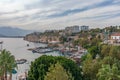 Top view of marina in harbor of old town of Kaleici with ships and boats and city over cliff and elevator Antalya Turkey