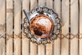 Top view of Marocchino is coffee drink from Alessandria, Italy. Served in a small glass and consists espresso cocoa powder and