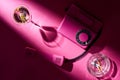 Top view of martini, pink telephone and astray with cigarette butts Royalty Free Stock Photo