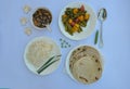 Top view of matar paneer veg, mashroom soup, roti chapati and rice Indian food isolated over white background