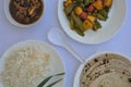 Top view of matar paneer veg, mashroom soup, roti chapati and rice Indian food isolated over white background