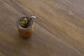 Top view of Mate caffeine-rich infused drink in a palo santo wood cup with a metal straw