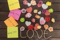 Top view of Me too message written in colorful stickers on a love knoted background