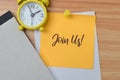 Top view of memo note written with text JOIN US Royalty Free Stock Photo