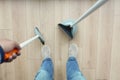 top view of men suing floor dust with dust pan