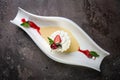 top view meringue dessert with strawberries in a stylish white plate