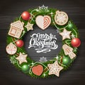 Top view of Merry Christmas concept design. Christmas wreath with cookies on wooden background.