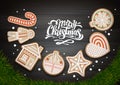 Top view of Merry Christmas concept design. Christmas wreath with cookies on wooden background. Royalty Free Stock Photo