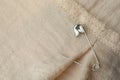 Top view of metal safety pin on clothing Royalty Free Stock Photo