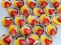 Top view of mini tarts with fresh strawberries, orange and kiwi isolated Royalty Free Stock Photo