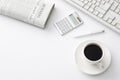 Top view of minimalist white table desk background with a cup of coffee. Royalty Free Stock Photo