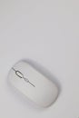 Top view of a minimalist white wireless optical computer mouse Royalty Free Stock Photo
