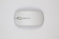 Top view of a minimalist white wireless optical computer mouse Royalty Free Stock Photo