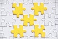 Top view of missing jigsaw puzzle with customizable space for text. Copy space with yellow background Royalty Free Stock Photo