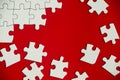 Top view of missing jigsaw puzzle on red cover background. Copy space Royalty Free Stock Photo