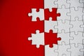 Top view of missing jigsaw puzzle on red cover background. Copy space Royalty Free Stock Photo