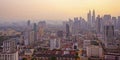 Top view of misty Kuala Lumpur city skyline with Petronas twin towers shot in the morning at sunrise Royalty Free Stock Photo