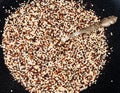 Top view of mix of quinoa seeds on black plate