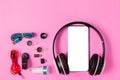 Top view mobile device with mobile blank space for text,.accessories. micro USB Adapter, macro lens and headset on pink background Royalty Free Stock Photo