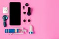 Top view mobile device with mobile blank space for text,.accessories. micro USB Adapter, macro lens on pink background Royalty Free Stock Photo