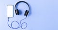 top view mobile gadgets device with listening to music on a blank white screen for your text. blue background Royalty Free Stock Photo