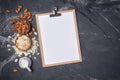 Top view of mock-up composition with clipboard and blank white sheet of paper with ingredients for almond milk Royalty Free Stock Photo