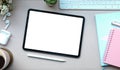 Top view mock up digital tablet with empty screen, stylus pen, earphone and coffee cup on white desk Royalty Free Stock Photo