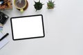 Mockup digital tablet with empty screen, camera, coffee cup, notebook and copy space on photographer workspace. Royalty Free Stock Photo