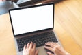 Top view mockup image of hands using and typing on laptop with blank white screen Royalty Free Stock Photo